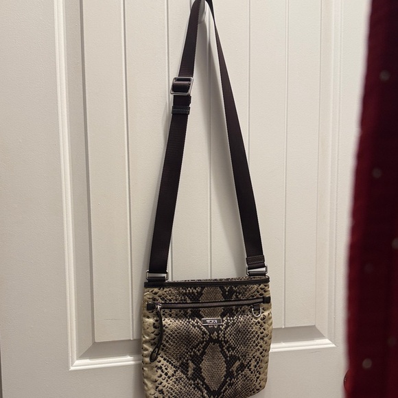 Tumi Handbags - Like New! Tumi Snake Print Crossbody Bag w/zip pockets- Black & Tan. 10”x10”